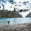 person standing near lake at daytime