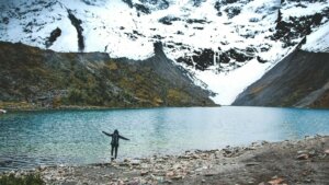 person standing near lake at daytime