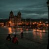 people walking on street during night time
